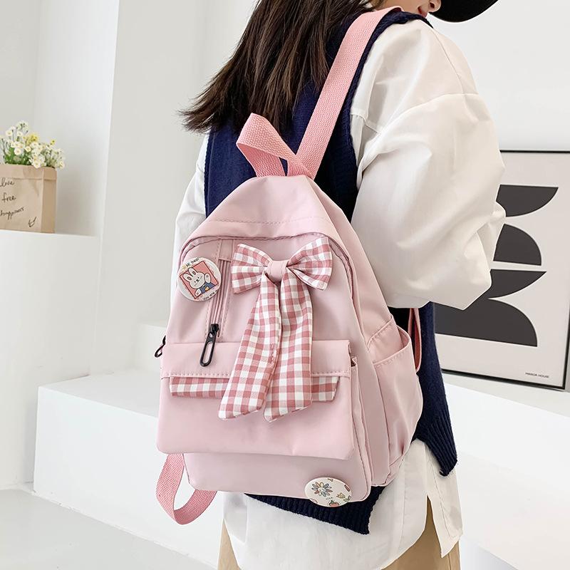 Bow schoolbag Female primary school students Large capacity 3rd to 6th grade high school lightweight weight weight reduction Cute simple backpack
