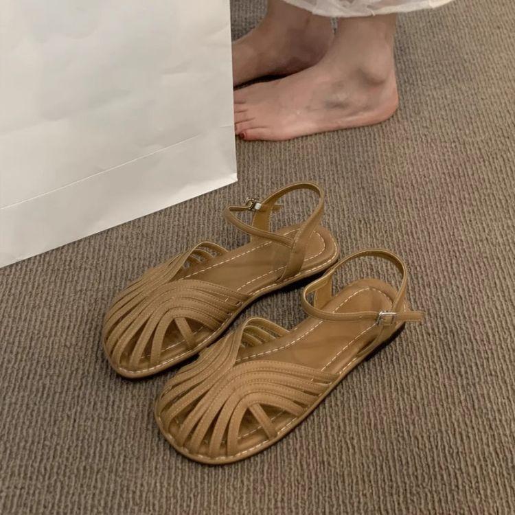 Mori baotou sandals female 2025 summer new fairy wind woven Roman shoes hollow flat bottom pig cage beach shoes