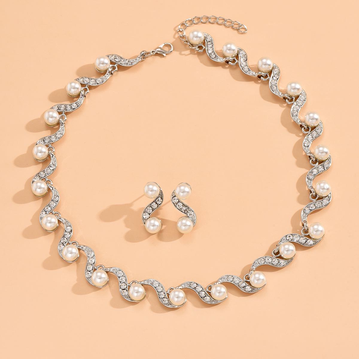 

Европейские и американские горячо продаваемые женские свадебные аксессуары для украшений из искусственного жемчуга S-образной формы 985# серебряный