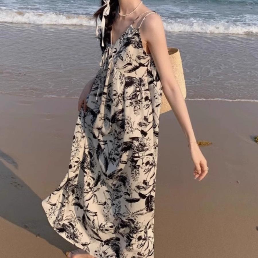 Holiday wind floral v-neck halter suspender dress for women's summer niche loose waist over knee A-shaped long dress wholesale
