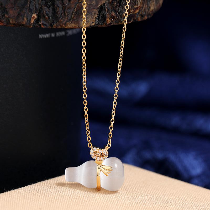 Chinese style imitation Hetian jade safety buckle necklace women's retro temperament titanium steel clavicle chain gold inlaid jade pendant with