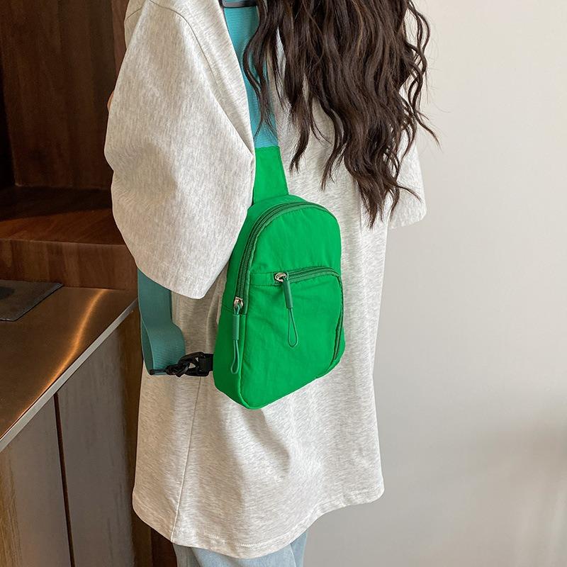Solid color light and simple going out portable casual mobile phone bag sports shoulder messenger bag breast bag men and women