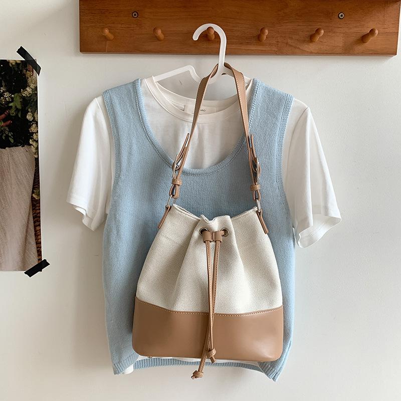 Neue koreanische Patchwork-Schultertasche mit Kordelzug für Damen, modisches Nischenprodukt, geräumige Canvas-Tasche für Pendler