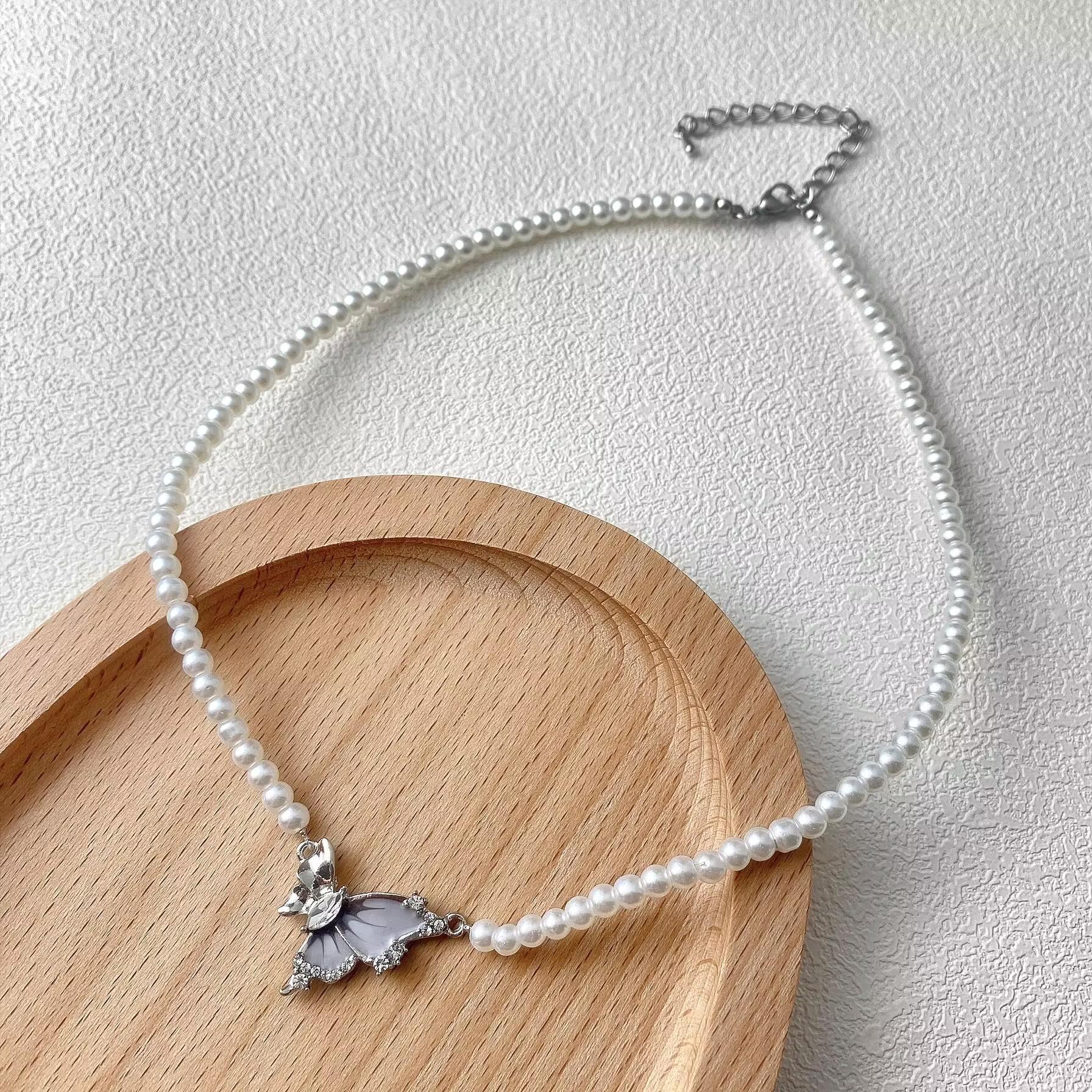 Elegant Blue Butterfly Pearl Necklace: Women s Fashionable Choker with Unique Design and Cool Style.