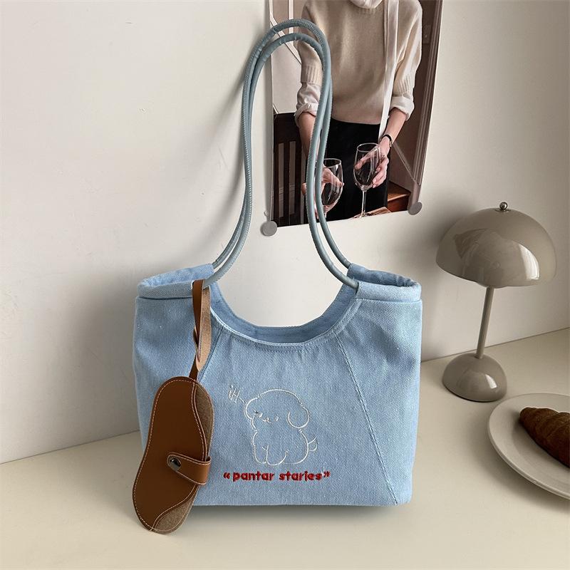 

Niche puppy large-capacity tote bag spring new armpit bag leisure commuter handbag versatile синій