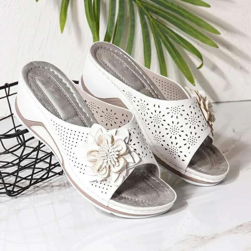 Large size slope heel slippers women's summer new hollow flower flat bottom one-word cool slippers beach women's shoes