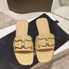 Dámské ploché pantofle 2025 Léto Nové Jednoduché Velká velikost Kovová přezka Temperament Slovo Vílí vítr Sandály
