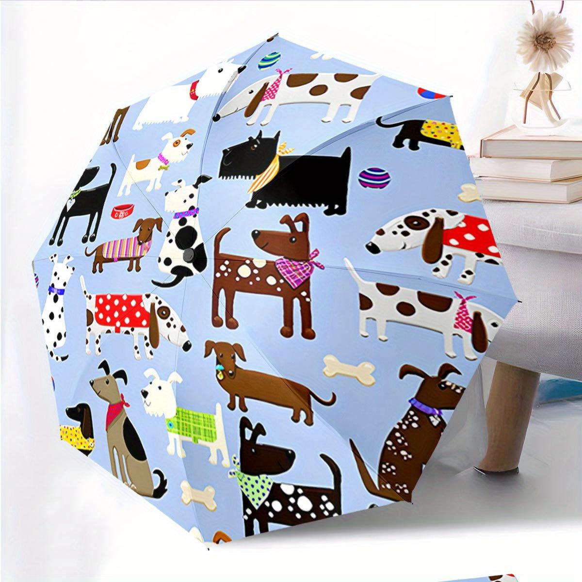 This Is an Automatic Folding Umbrella Adorned with a Design of Different Cartoon Dogs Sporting Vibrant Additions Against a Light Blue Backdr