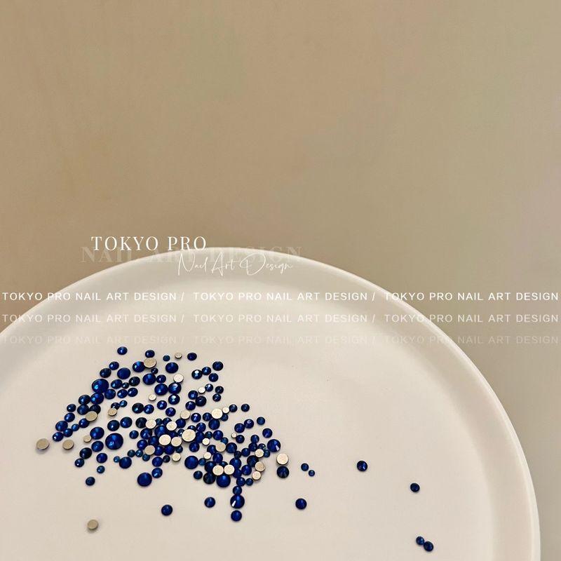 

TP Строго отбирает B Красота ногтей Плоское дно Стразы Цвет круглый Плоский Бриллиант Украшение для ногтей Стразы для ногтей Клеящиеся Сине-зеленая серия About 50 pieces of 24# Sapphire