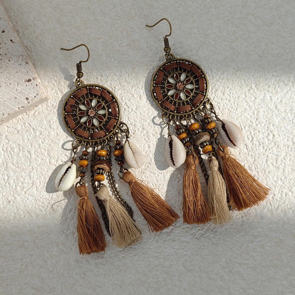Retro ethnic style woven feathers long fringed earrings, bohemian high-end hollow rice bead earrings