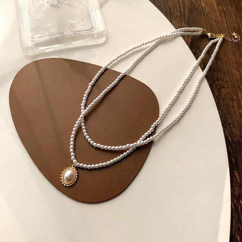 

Light luxury simple atmosphere camellia pearl necklace small fresh temperament flower pendant collarbone chain versatile high sense