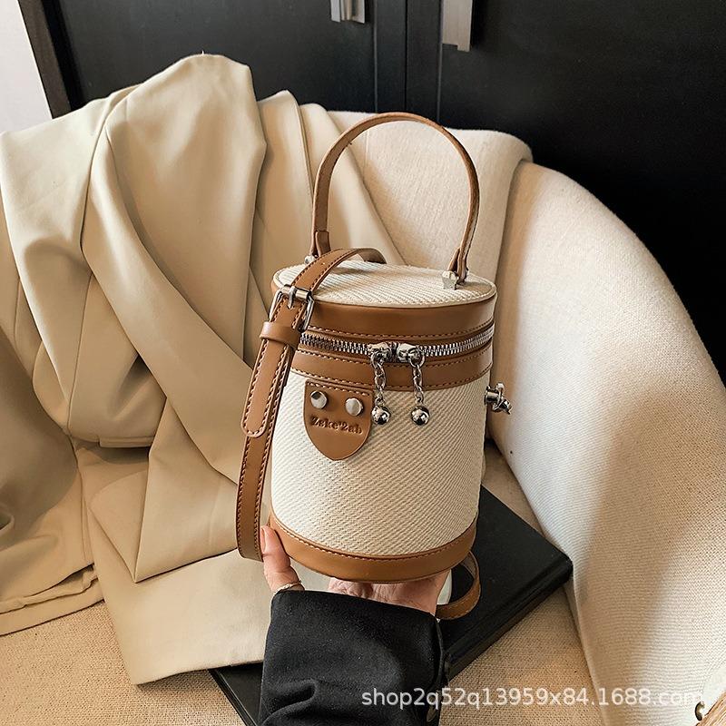 Niche design fashionable contrasting color portable canvas bag women's spring new versatile messenger bucket bag