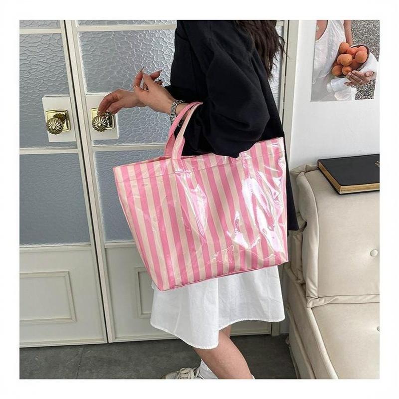 This Water-Resistant Pvc Tote Bag Features A Pink And Blue Striped Design, A Large Capacity, And Is Suitable For Beach Shopping,