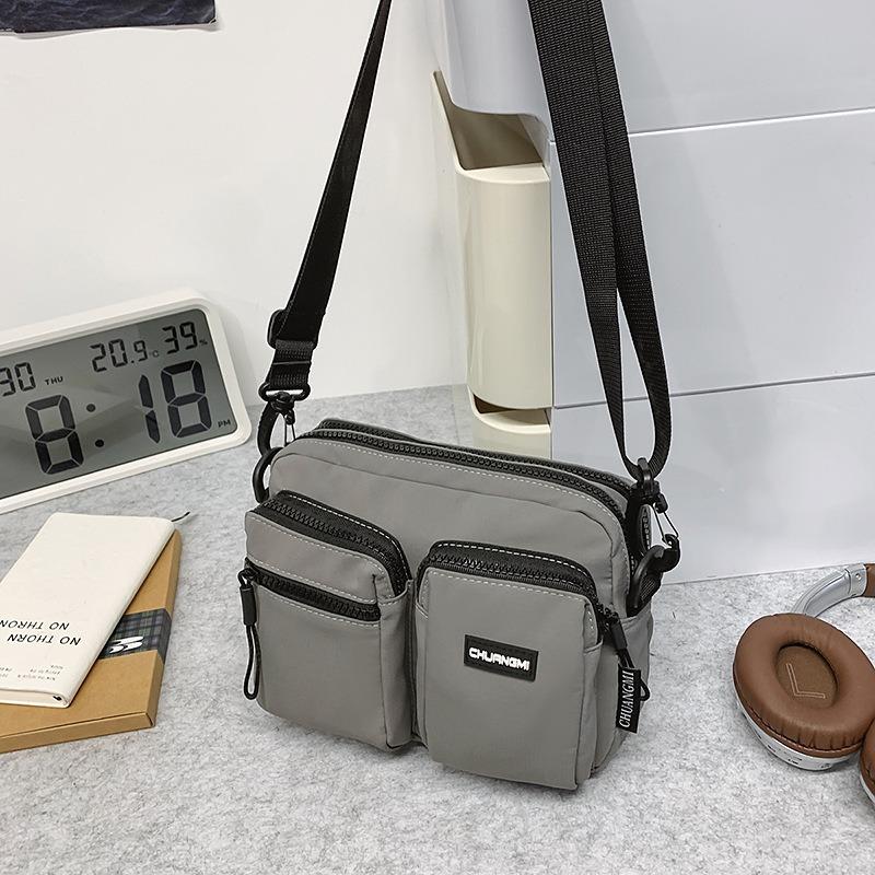 Outdoor leisure multi-pocket canvas messenger bag women's and men's simple travel nylon single shoulder small square bag