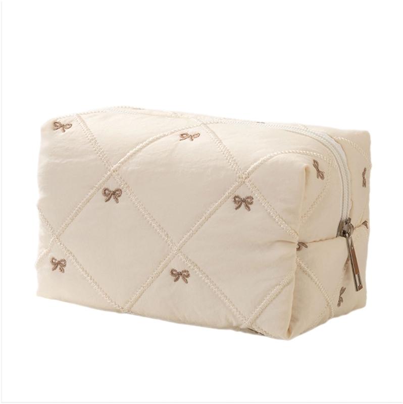 

Large Capacity Makeup Organizers with Quilted Bowknot Accent and Multiple Divisions for Efficient Travel