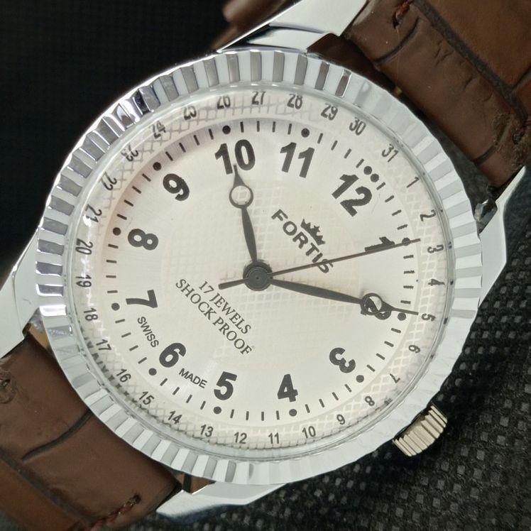 

ВОССТАНОВЛЕННЫЕ ШВЕЙЦАРСКИЕ МУЖСКИЕ НАРУЧНЫЕ ЧАСЫ FORTIS WINDING СЕРЕБРЯНЫЙ ЦИФЕРБЛАТ 622c-a416860-2 lot622c-a416860