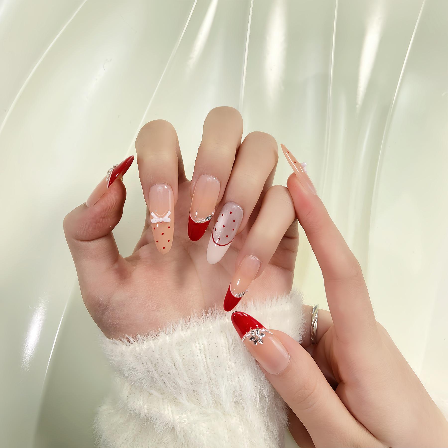 Handmade Red White Polka Dot Press-On Nails with Bow, Snowflake, and Rhinestone Accents