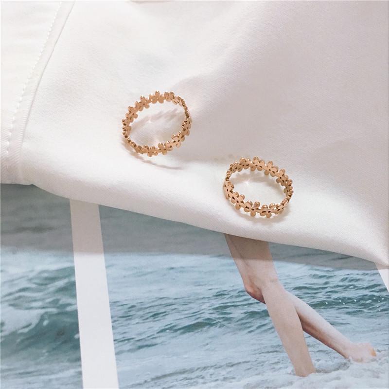 Korean Style Gold-Plated Titanium Steel Hollow Flower Ring for Women