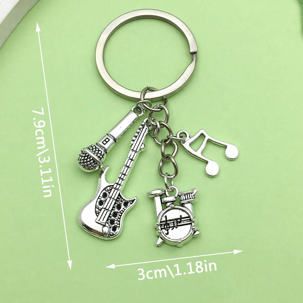 Antique Silver Music Cassette & Saxophone Keychain with Creative Design