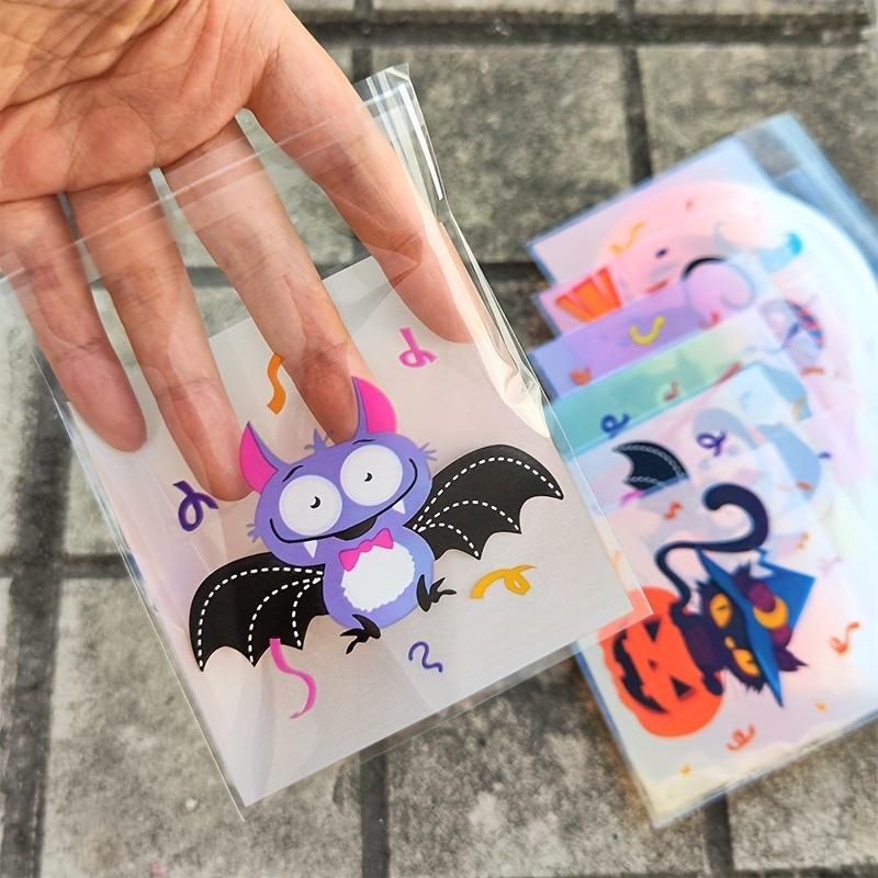 100pcs Halloween Gift Bags. Self-adhesive with pumpkin, ghost & bat designs for party treats.