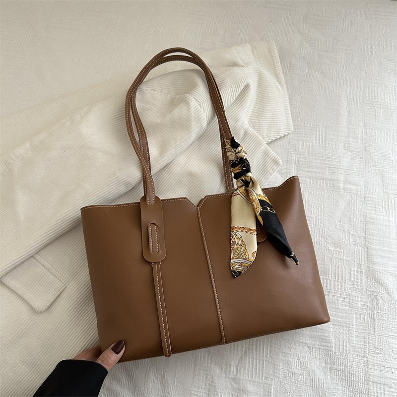 

2025 лето новая большая вместимость сумка для мамы и ребенка женская универсальная сумка через плечо в иностранном стиле портативная сумка-тоут женская сумка светло-коричневого