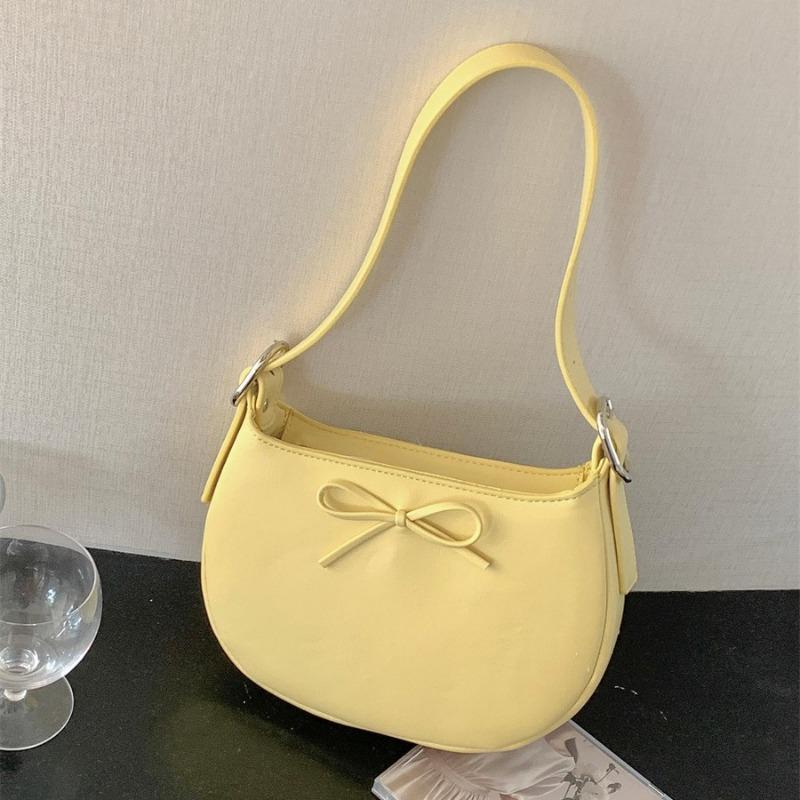 Niche style underarm bag women's oval simple small handbag fashion bow spring and summer new shoulder bag women