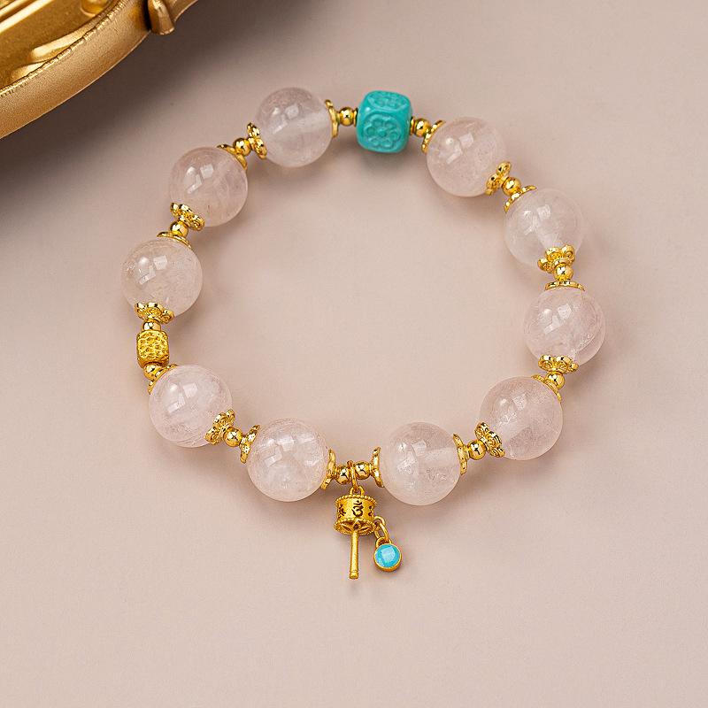 Light luxury powder crystal bracelet, original gold-plated flower vajra pestle pendant, premium temperament hand beaded bracelet.
