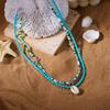 Bohemian Ocean Style Beaded Necklace with Pearls, Starfish, and Shells