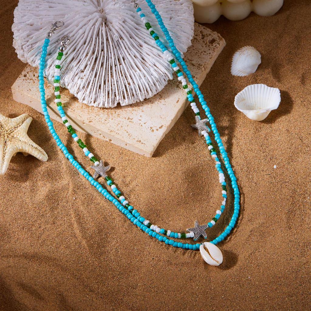 Bohemian Ozean Stil Perlenkette mit Perlen, Seesternen und Muscheln