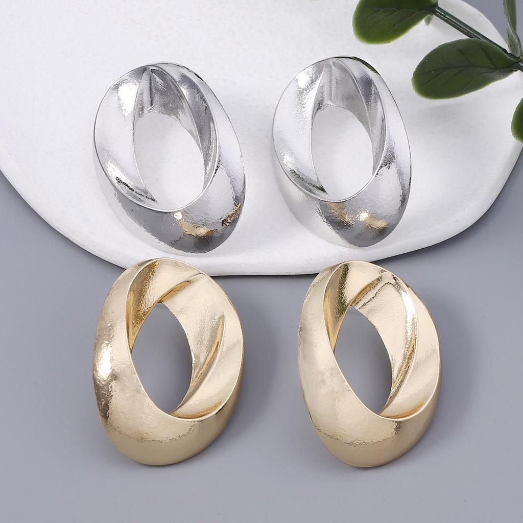 Geometric Circular Hollowed-out Elliptical Metal-textured Earrings for Both Men and Women, with a Cold and Simple Style for Couples