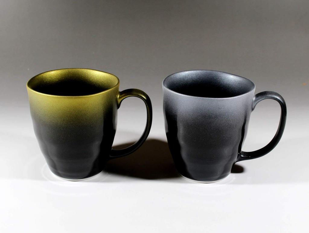 Pair of ceramic mugs in a paulownia box made by an Arita ware potter with great care Tenmoku glaze gold color platinum color Ceramic artist Nishikiya