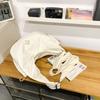 Hua'er and Xiao have the same casual trendy brand dumpling bag, women's sports cycling messenger bag, and boys' large-capacity shoulder bag.