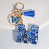 1pc Custom Blue Alphabet Letter Keychain with Butterfly Pendant Resin Ladies Key Ring with Tassel - Elegant Accessory for Bags Backpacks