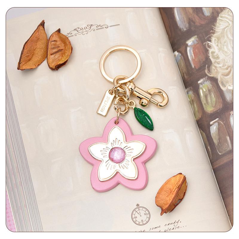 Marque de Luxe Sac Fleur Pendentif Mode Élégant Métal Cuir Créatif Exquis Polyvalent Mignon Accessoires Sac Porte-clés