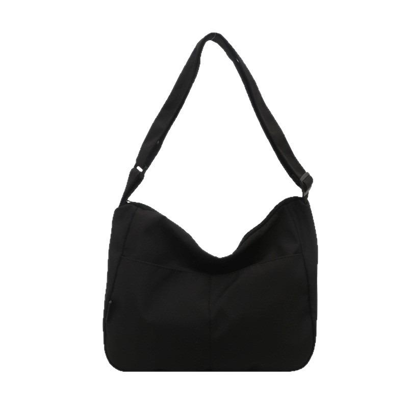 New casual messenger canvas bag, simple large-capacity shoulder bag, niche design sense, daily commuter bag