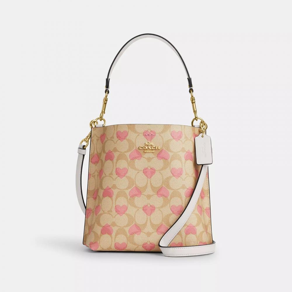

Сумка-ведро Coach Mollie 22 из фирменной парусины с принтом в виде сердечек