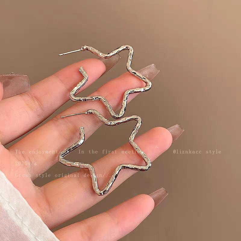 

Niche cold wind bump irregular five-pointed star earrings women s 111 silver needle high-end earrings temperament earrings