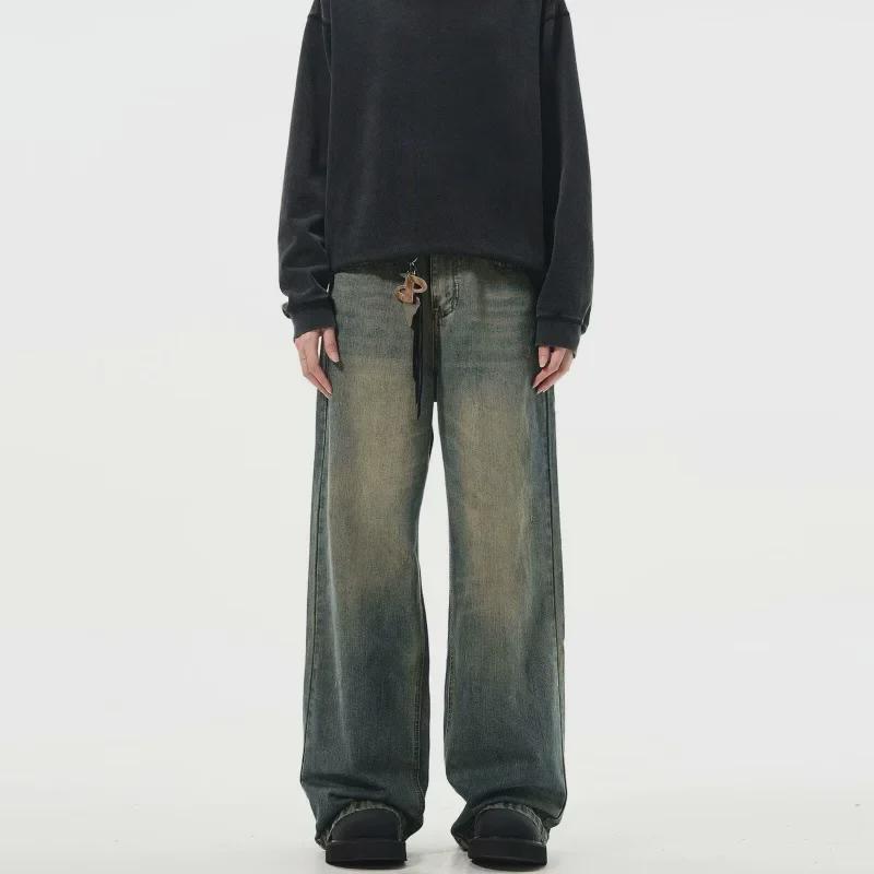 "Autumn Retro Men's Yellow Mud-Dyed Wide-Leg Jeans: American Brand, Loose Fit, Washed & Distressed."
