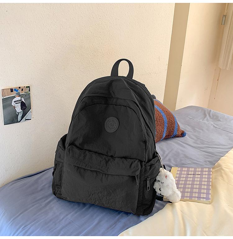 School bag Japanese simple solid color backpack light commuting large capacity student school bag casual versatile outdoor travel backpack
