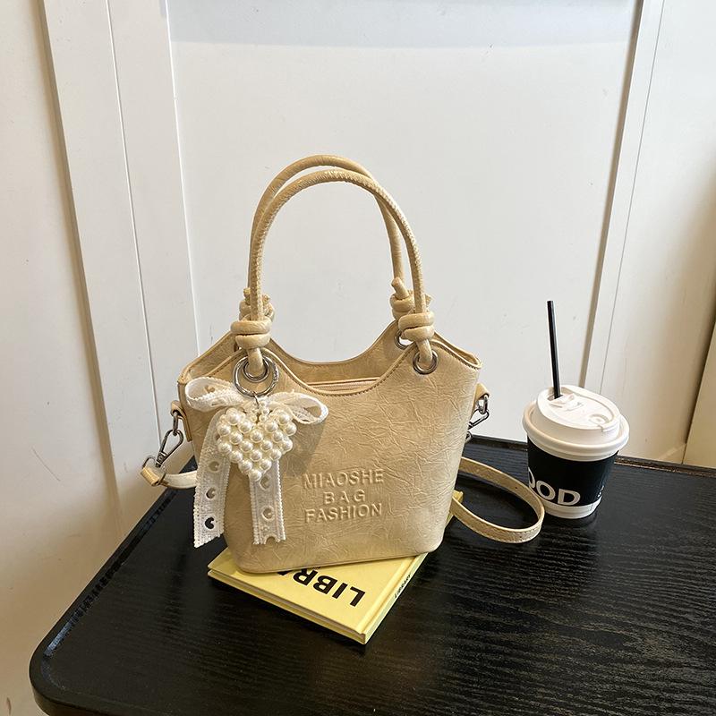 

New high-end texture exquisite fashion simple bucket bag summer versatile commuting temperament messenger bag woman жовтий