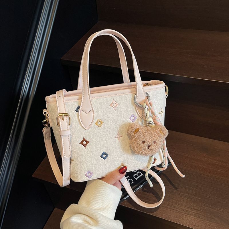

Summer Super Hot Portable Bucket Bag Women 2025 New Light Luxury Niche Design High Sense Shoulder Vegetable Basket Bag Pink + pendant