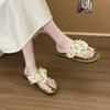 2025 Sommer neue Hausschuhe Damenschuhe flach lässig vielseitig Blume Thai Nesting Feenwind Strandschuhe