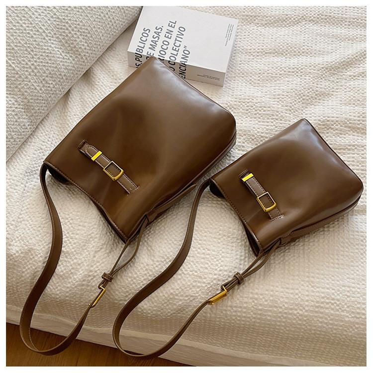 2023 Fashionable Simple Commuter Light Luxury Bag Buckle Shoulder Crossbody Bag Black Coffee Color City Simple Pu Bucket Bag