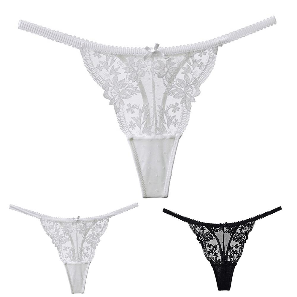

Женские мини-трусики G-string просвечивают сквозь прозрачную Т-образную спину