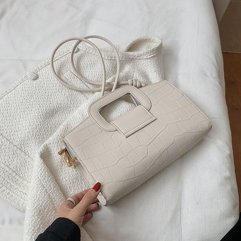 Elegante tekstur damevesker allsidige skulder-crossbody-vesker feminine jobb- og crossbody-pendel-vesker monokrome og retro nye