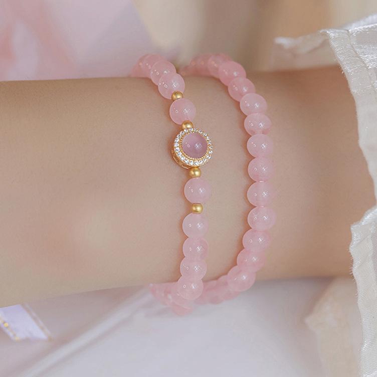 Bracelet en cristal de poudre de calcédoine perle d'eau douce bracelet en cristal breloque féminine fleur de pêcher cœur de fille frais, doux et à la mode