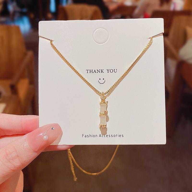 Trendy Bamboo Titanium Steel Necklace with Cat's Eye Stone – High-End, Luxurious Clavicle Chain for Women