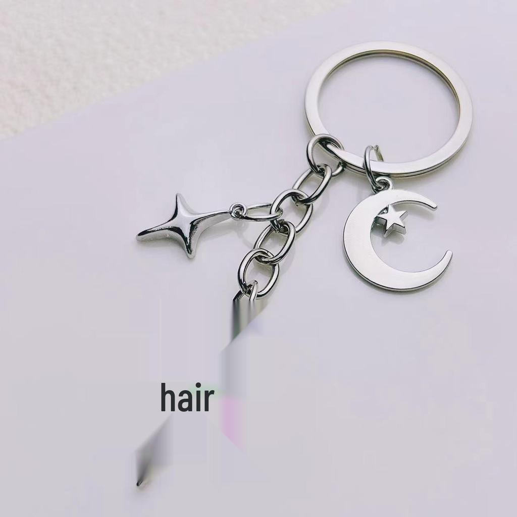 Elegant Star and Moon Hollow Keychain - Unisex Fashion Bag Pendant.