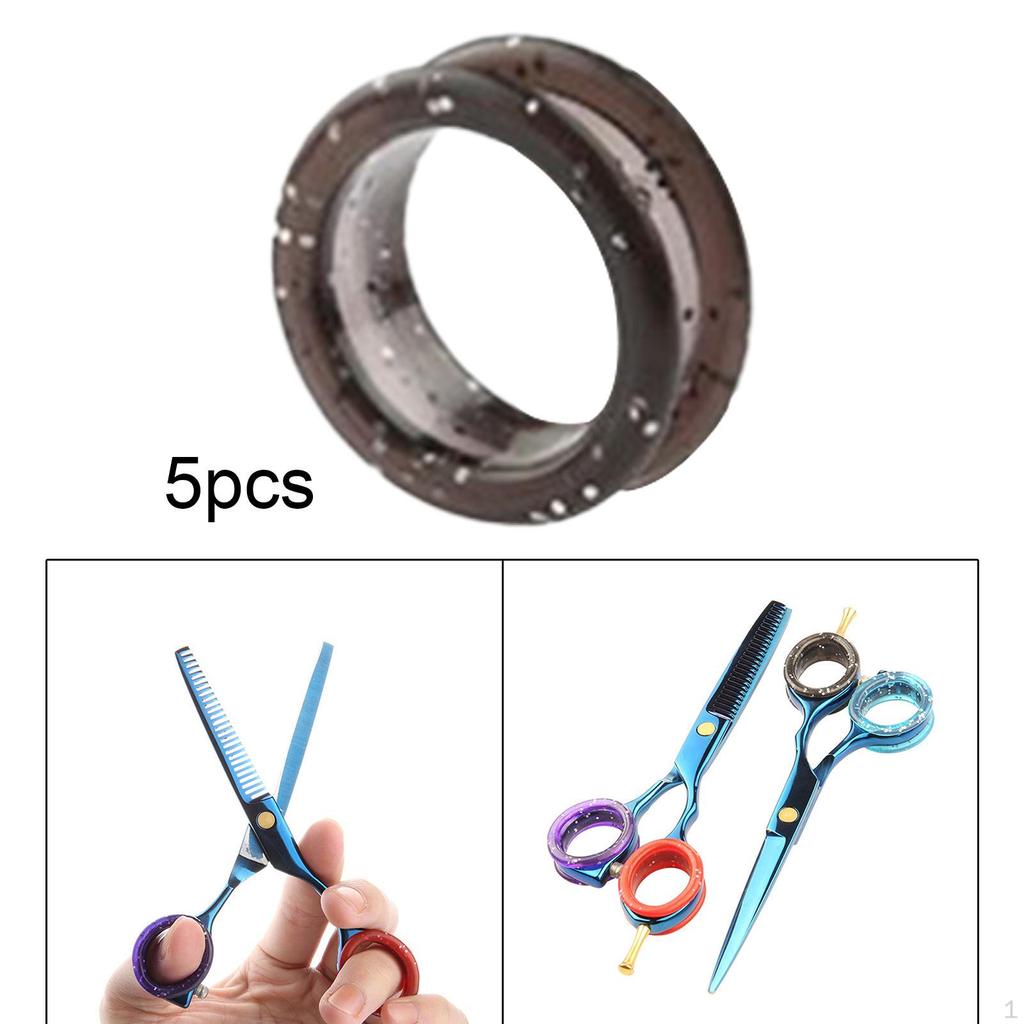 5-teiliges Scheren-Set mit Fingerringen, Griffeinsätzen und Zubehör für die Haarpflege.