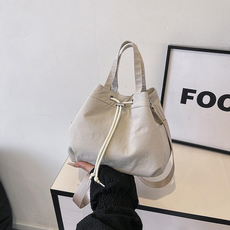 Casual Niche Drawstring Hand-held Bucket Bag Crossbody Bag for Women 2026 New Trendy Versatile Simple Small Bag Cloth Bag
